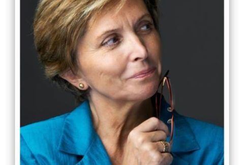 A woman is sitting and pondering a thought