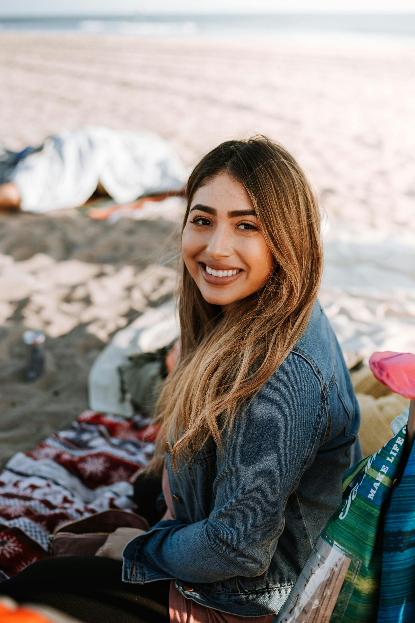 A business woman is standing and smiling