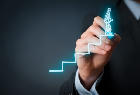 A man is drawing a type of bar graph on the screen