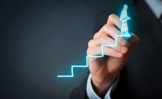 A man is drawing a type of bar graph on the screen