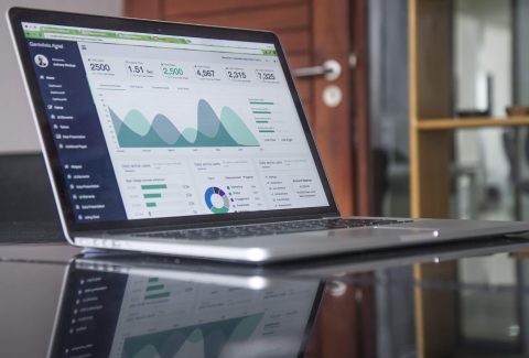 A picture of an open laptop computer with a bar chart on the screen