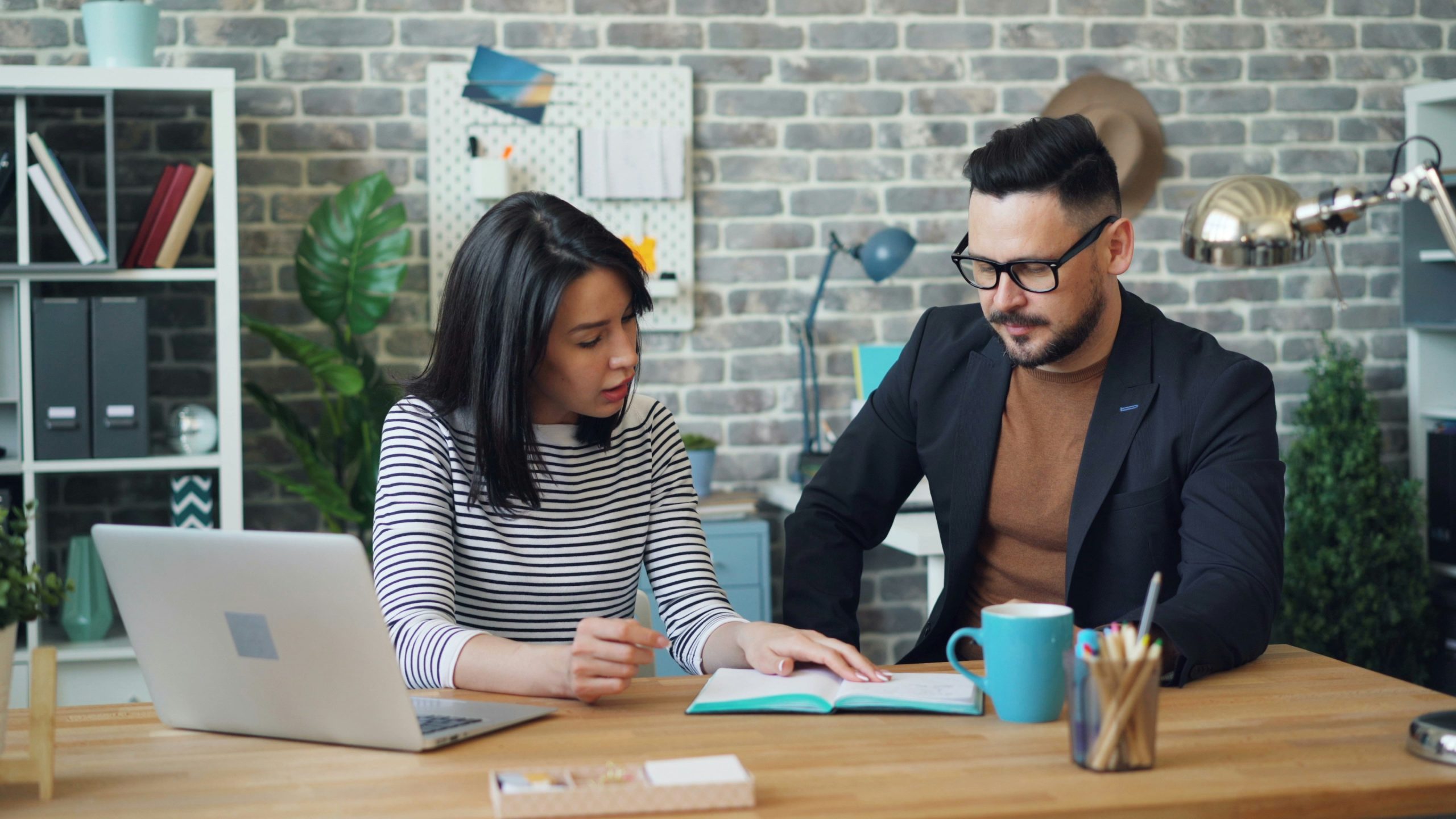 A man and a woman are sitting and talking